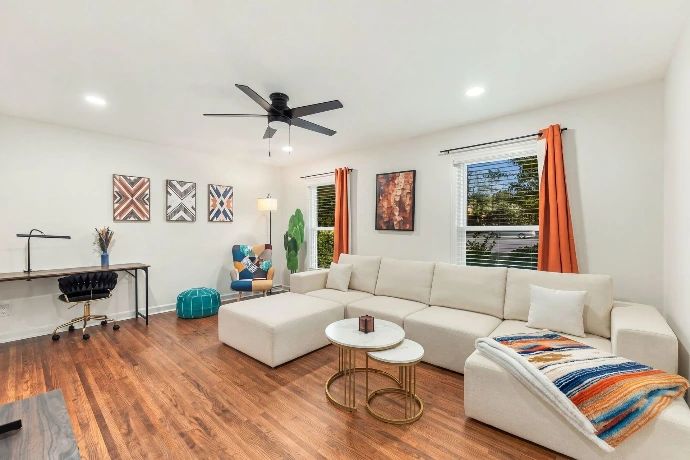 Living room with comfortable sofa and 65 inch TV
